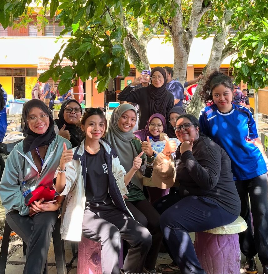 Bella and her team at an outdoor community event